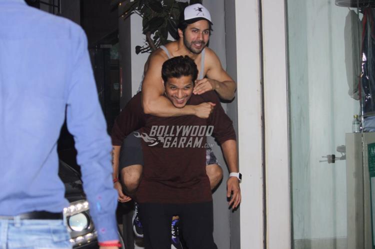 Varun Dhawan snapped in a playful mood with trainer